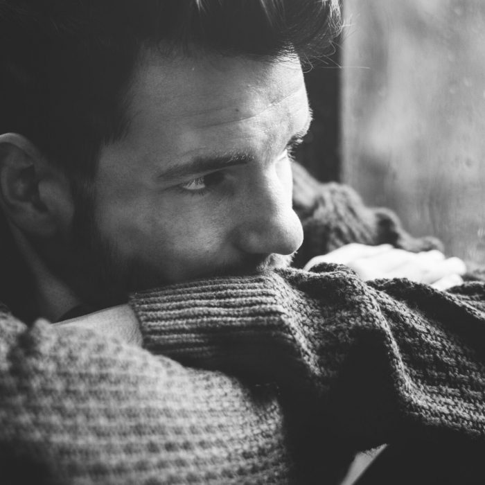 Man looking out the window